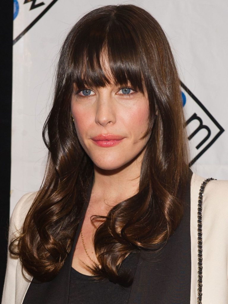 Organic long hairstyles for oval faces with bangs